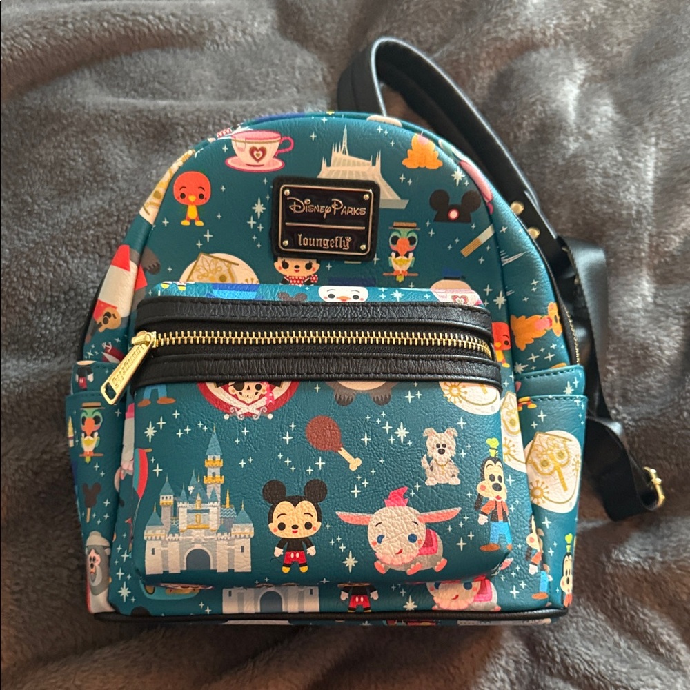 Loungefly Disney Parks Teal Mini Backpack never used !
